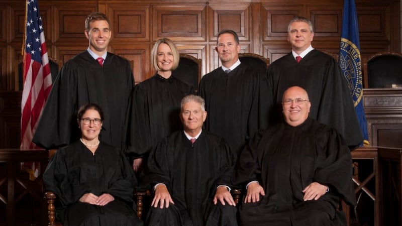 Judges of the Nebraska Supreme Court (and when they were appointed), front row from left:...