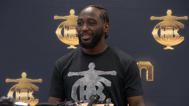 Record-setting champion boxer Terence "Bud" Crawford talks with news media ahead of the parade...