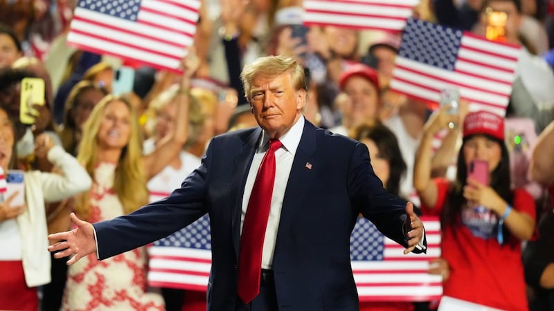 Image 16: President Donald Trump greets supporters as he arrives on the stage at the Republican...
