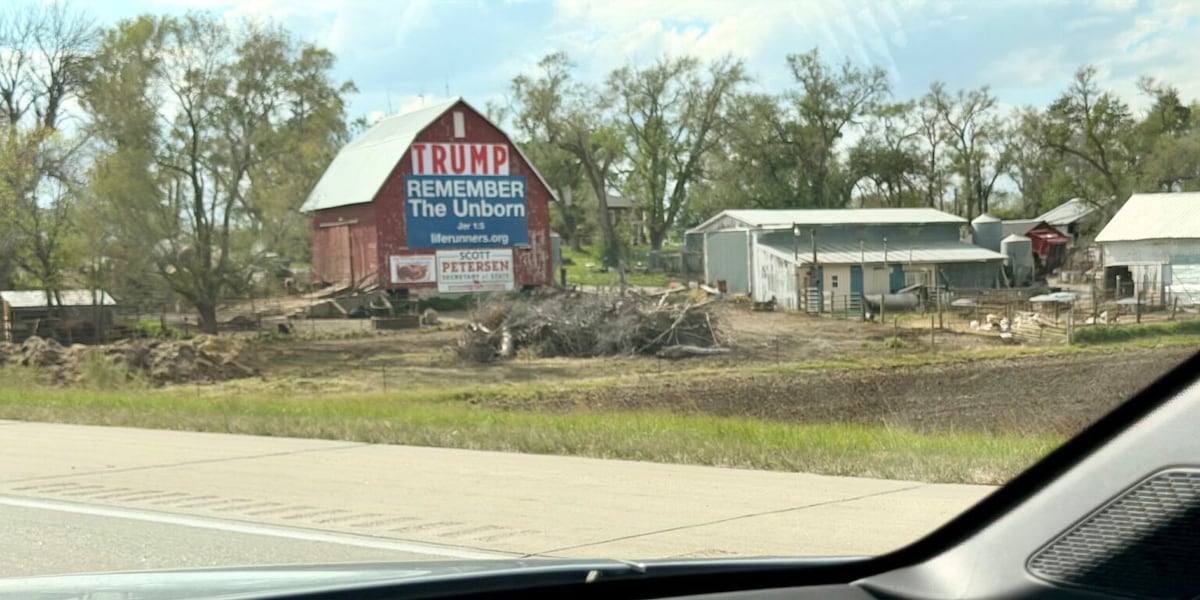 ‘Trump Barn’ regains its sign, thanks to anonymous donor and installation help