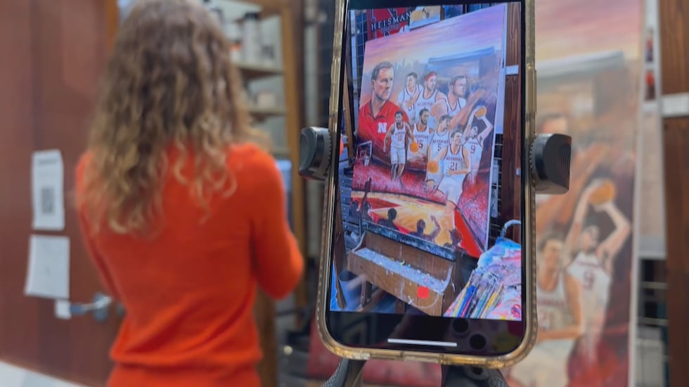 Ashley Spitsnogle, a Licensed Husker Artist, working on her piece for the basketball season at...