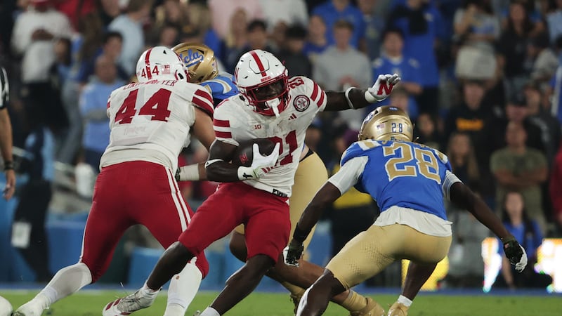 Nebraska running back Emmett Johnson (21) rushes the ball against UCLA during the first half...