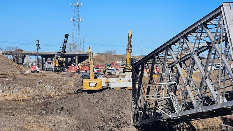 Union Pacific crews were out on Thursday rebuilding a century-old railroad bridge that caught...