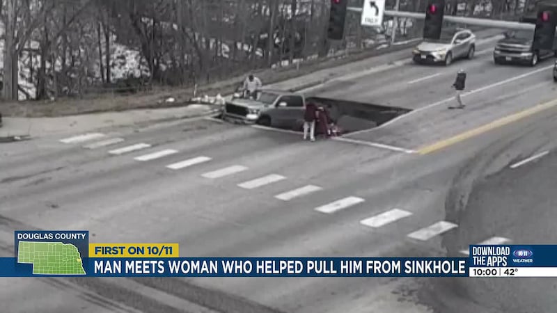 The Omaha man who fell into a sinkhole was reunited with the woman who helped him out.